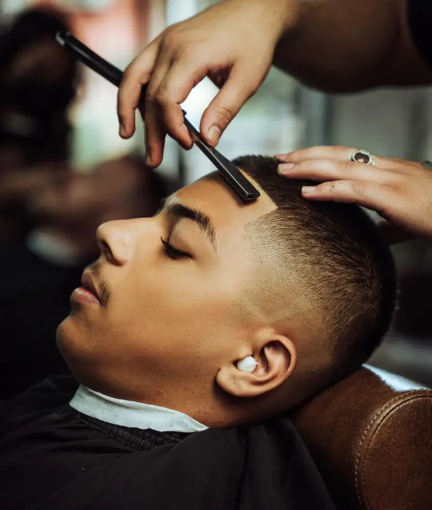 Barber doing a haircut